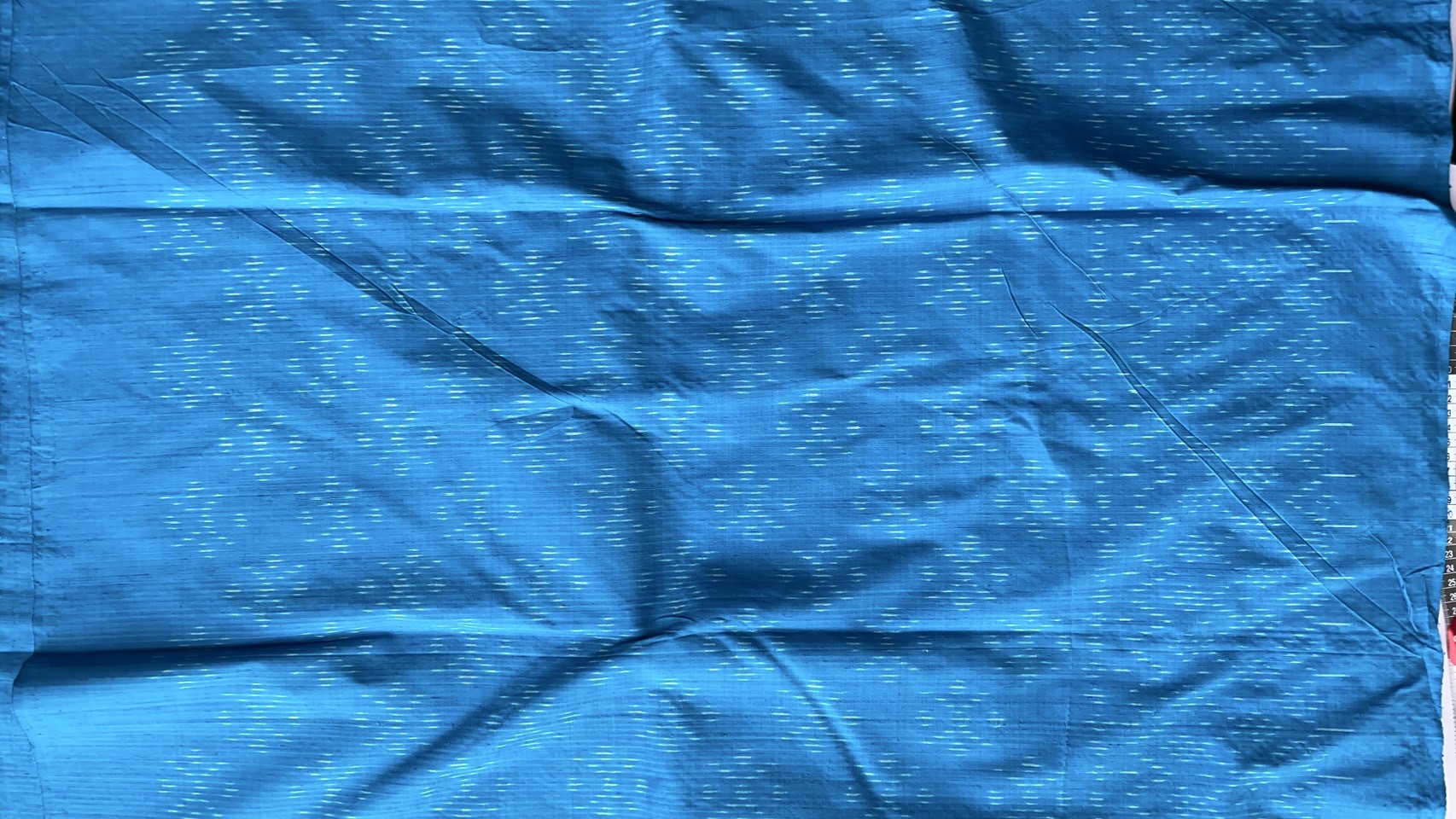 ผ้าไหมมัดหมี่ เนื้อไหมบ้าน ไหมแท้ ลายดอกแก้ว สีฟ้า ตัดขายเป็นเมตร รหัส CISP-NY-SKU-44173