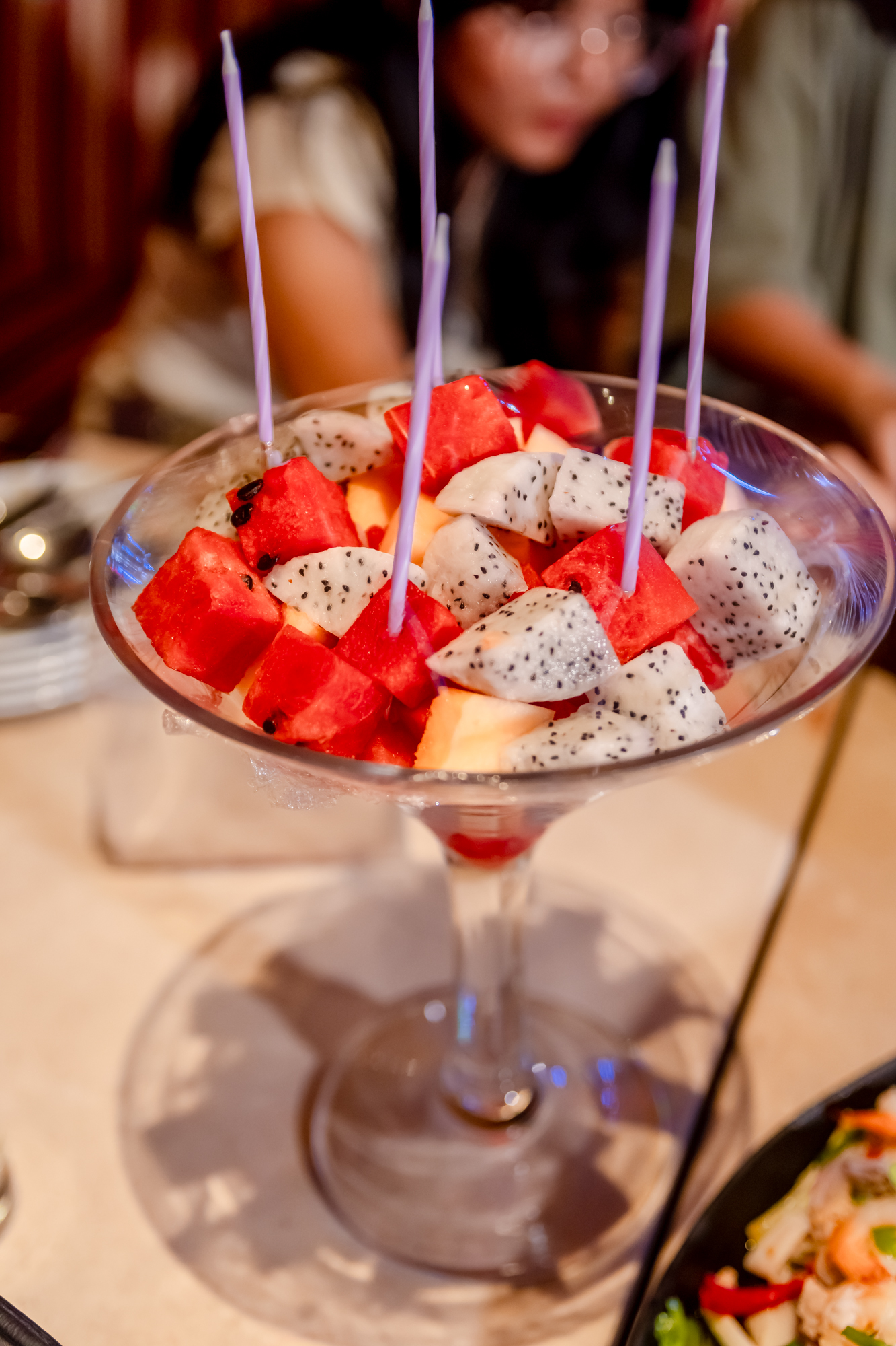 A glass with fruit in it

Description automatically generated
