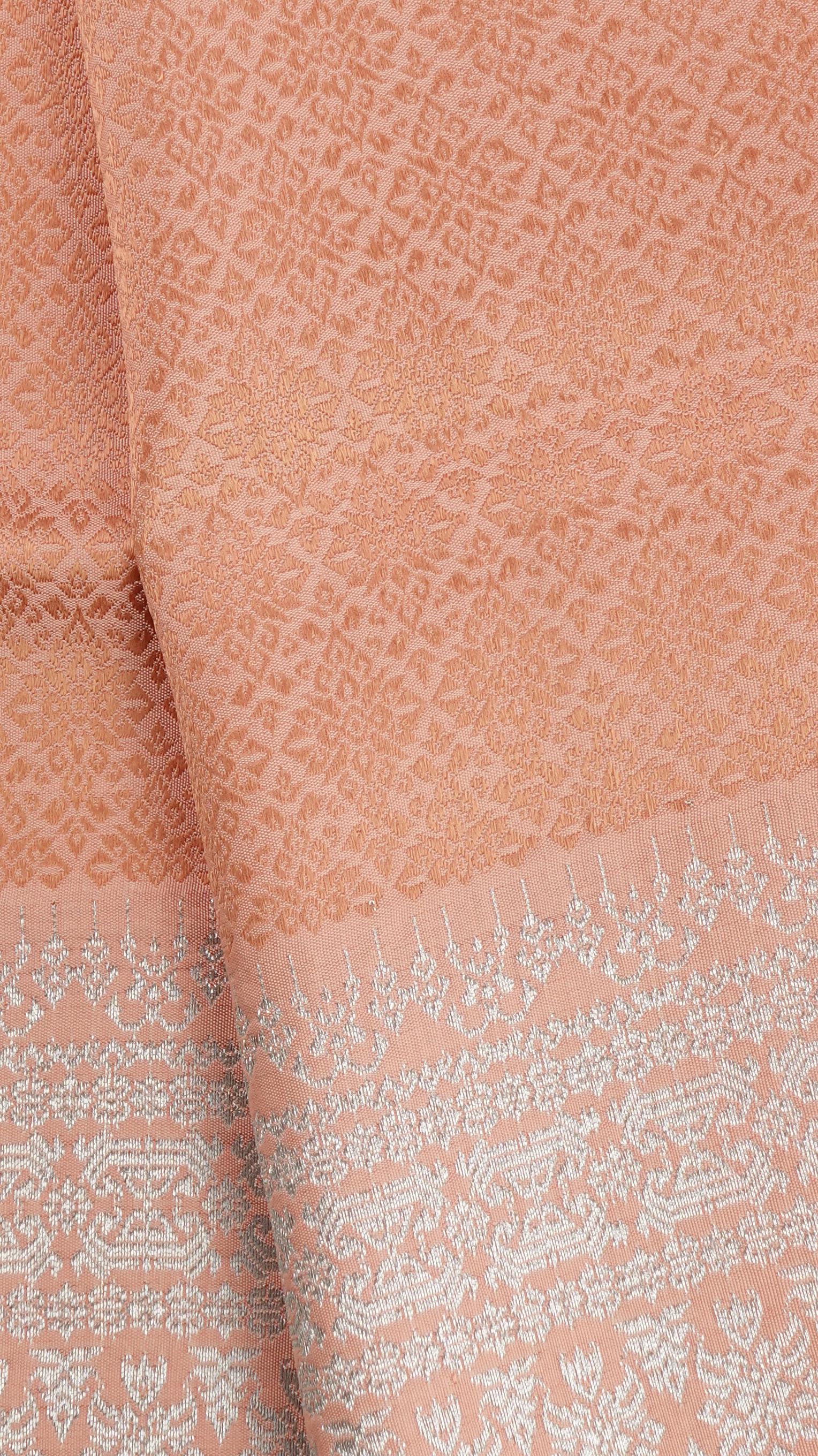 ซิ่น ผ้าไหมยกสุรินทร์ ไหมแท้ ไหมแท้ เกาะเชิงดิ้นเงิน (ไม่มีหน้านาง) ขนาด 1x2เมตร พื้นสีส้มอ่อน N11-NY-0901677