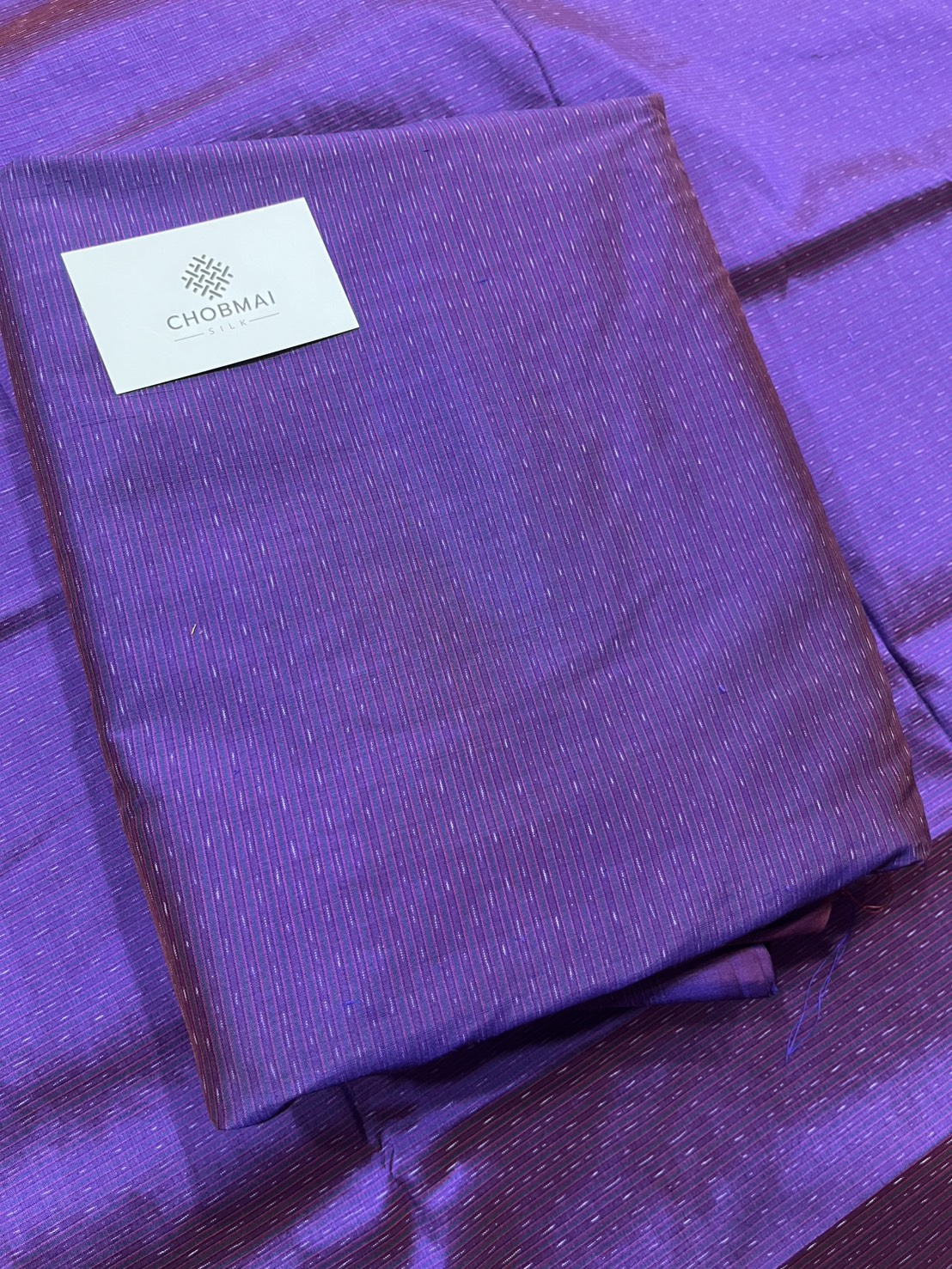 ผ้าไหมมัดหมี่ ไหมแท้ ลายอัมปรม สีม่วง ตัดขายเป็นเมตร รหัส CISP-NY-1024682