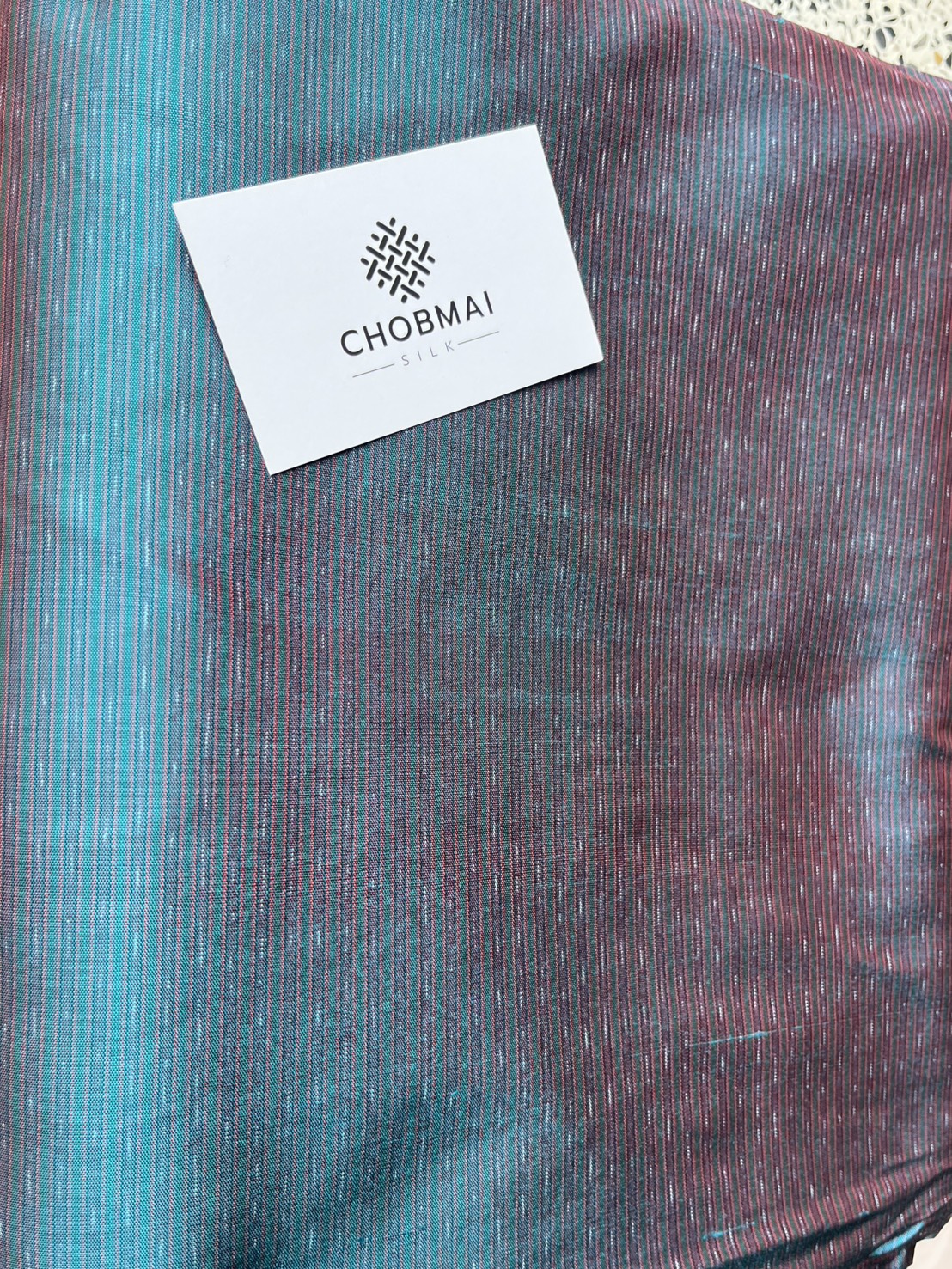 ผ้าไหมมัดหมี่ ไหมแท้ ลายอัมปรม สีเขียวเทอร์ควอยซ์ ตัดขายเป็นเมตร รหัส CISP-NY-1024683