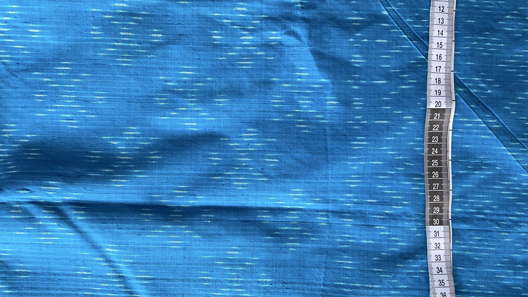 ผ้าไหมมัดหมี่ เนื้อไหมบ้าน ไหมแท้ ลายดอกแก้ว สีฟ้า ตัดขายเป็นเมตร รหัส CISP-NY-SKU-44173