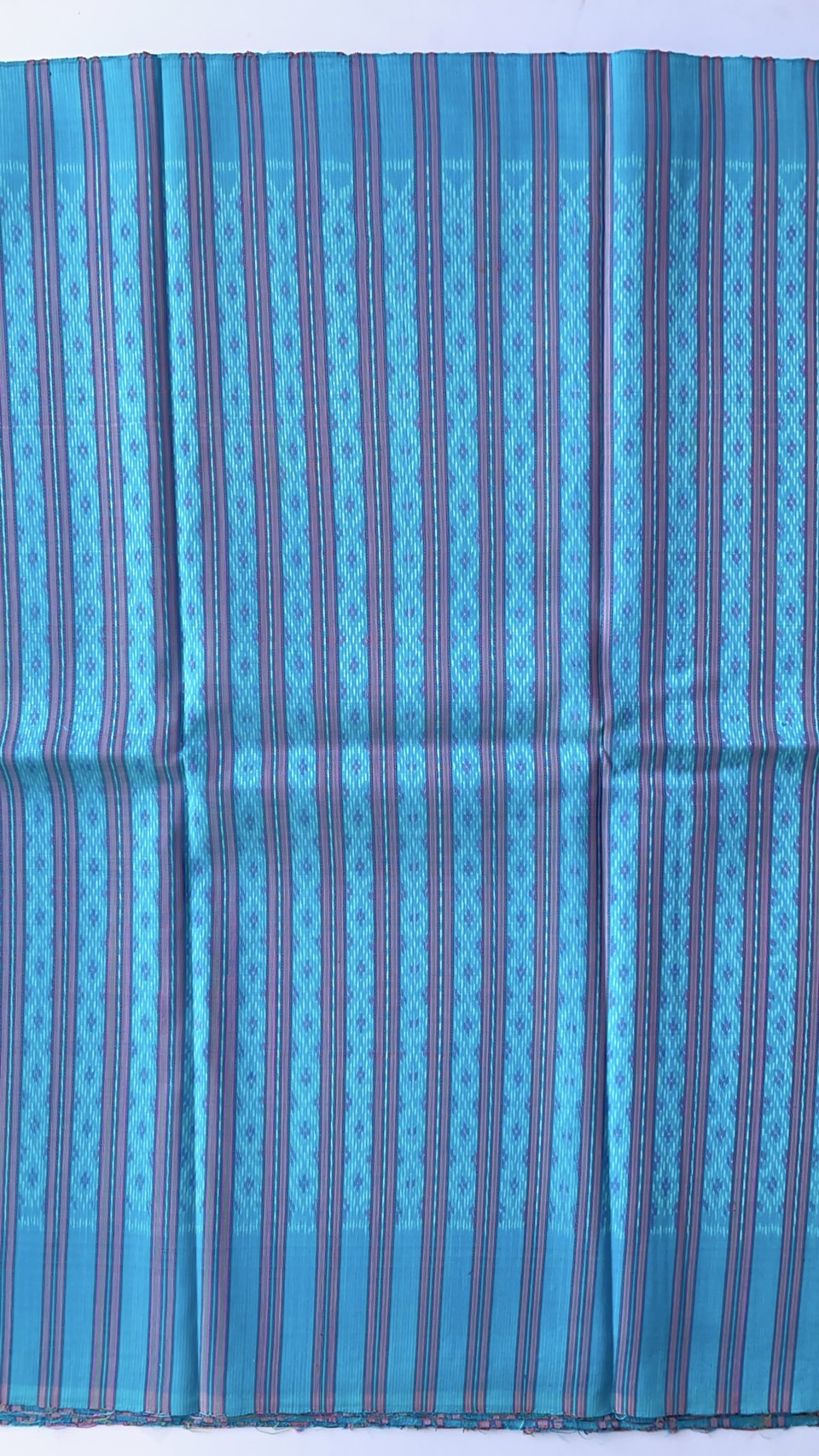 ผ้าไหมมัดหมี่ เนื้อไหมบ้าน ไหมแท้ ลายโฮลคั่นโคมเจ็ด สีฟ้า ตัดขายเป็นเมตร รหัส CISP-NY-SKU-44172