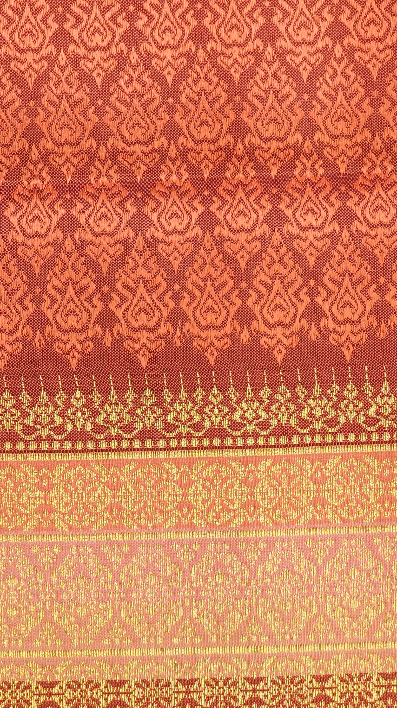 ซิ่น ผ้าไหมยกสุรินทร์ ไหมแท้ ขนาด 1x2เมตร เกาะเชิงดิ้นทอง พื้นสีส้มอิฐ N11-NY-0901673