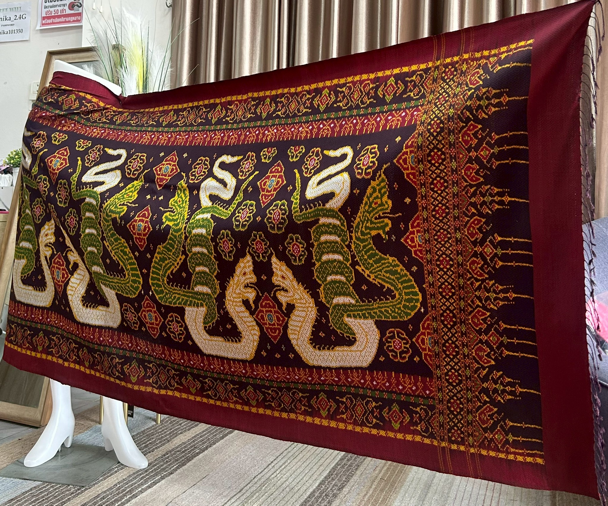 ซิ่น ผ้าไหมมัดหมี่ทอยกดอก 6ตะกอ ขนาด 1x2เมตร ลายนาคพันทรัพย์ มีหน้านางชายครุย พื้นสีแดง รหัส M2A-PK-1006681