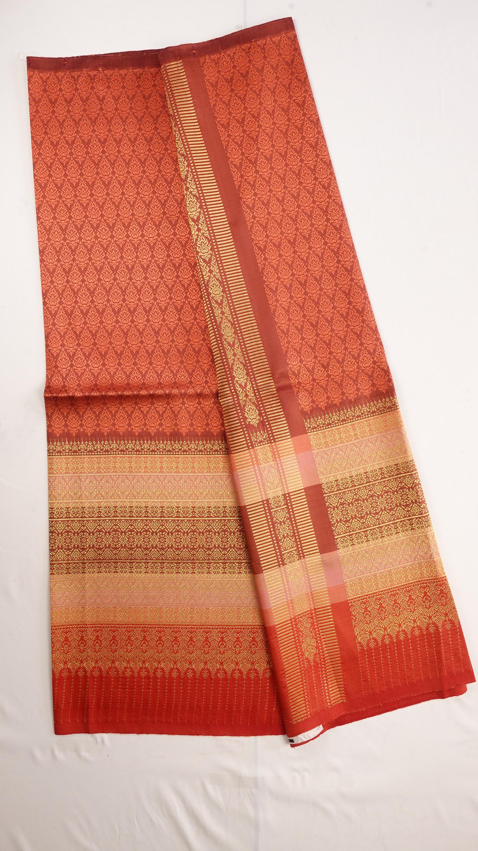 ซิ่น ผ้าไหมยกสุรินทร์ ไหมแท้ ขนาด 1x2เมตร เกาะเชิงดิ้นทอง พื้นสีส้มอิฐ N11-NY-0901673