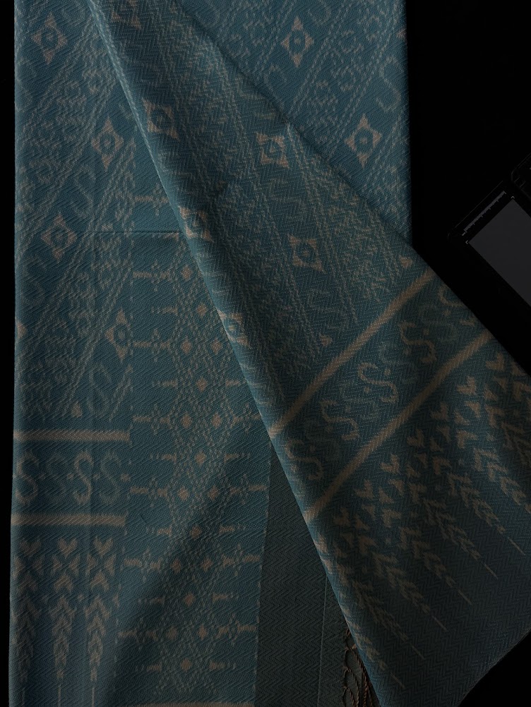 ซิ่น ผ้าไหมมัดหมี่ก้างปลา ทอยกดอก 4 ตะกอ ขนาด 1x2 เมตร ลายสิริราชพัสตราภรณ์ สีฟ้า รหัส PCS-NY-1122684