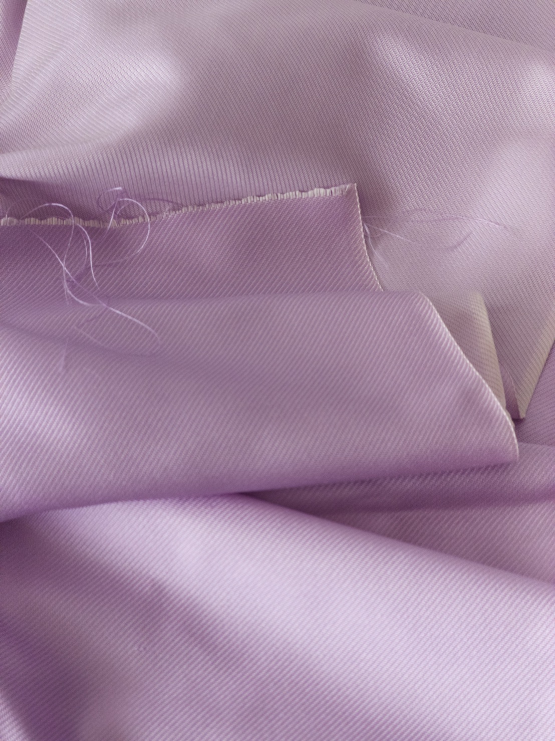 ผ้าไหมยก 4ตะกอ สีพื้นเนื้อลูกฟูก ไหมแท้ สีม่วงอ่อน (ราคาต่อเมตร) รหัส B-119-1074WA7