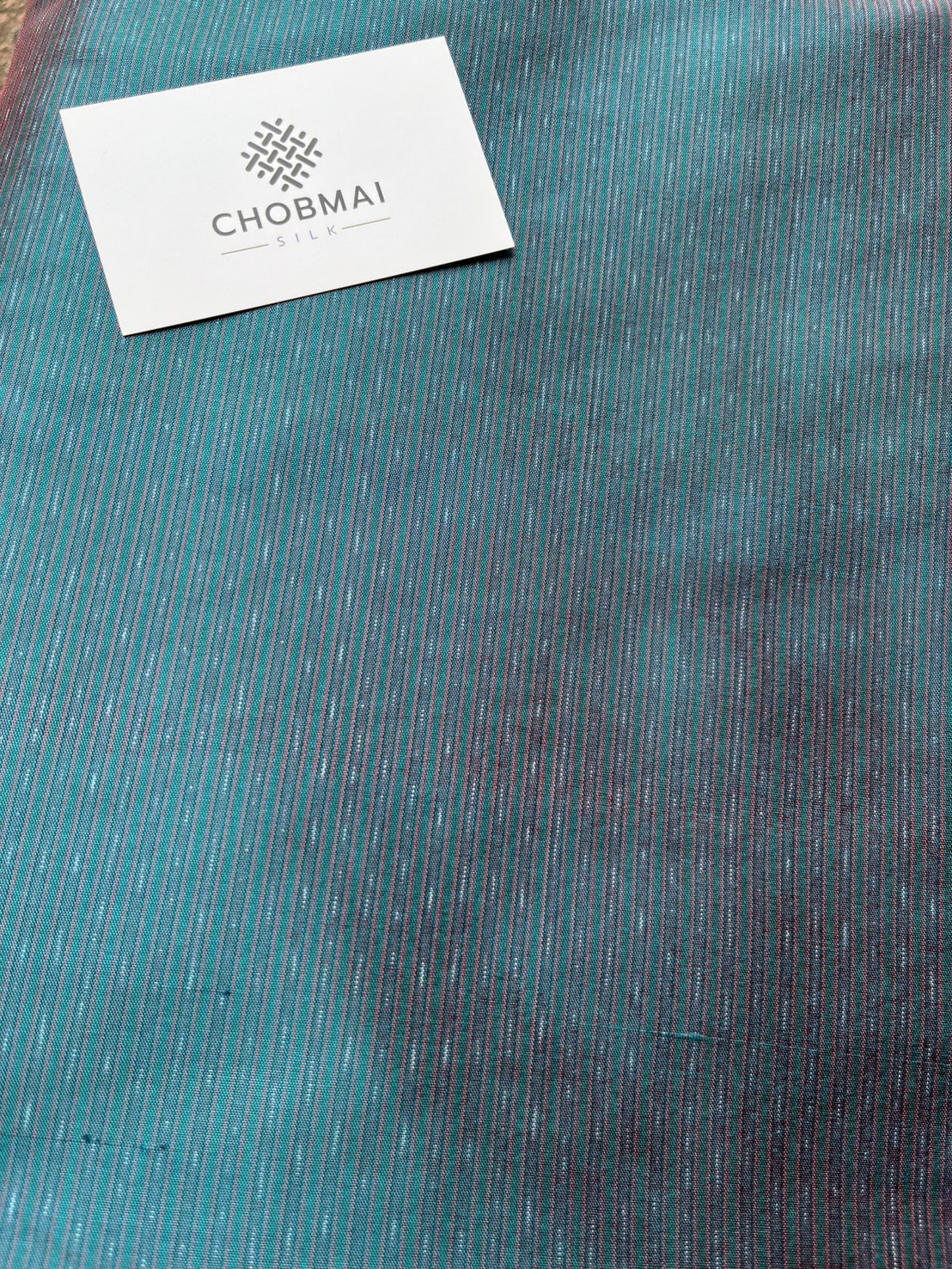 ผ้าไหมมัดหมี่ ไหมแท้ ลายอัมปรม สีเขียวเทอร์ควอยซ์ ตัดขายเป็นเมตร รหัส CISP-NY-1024683