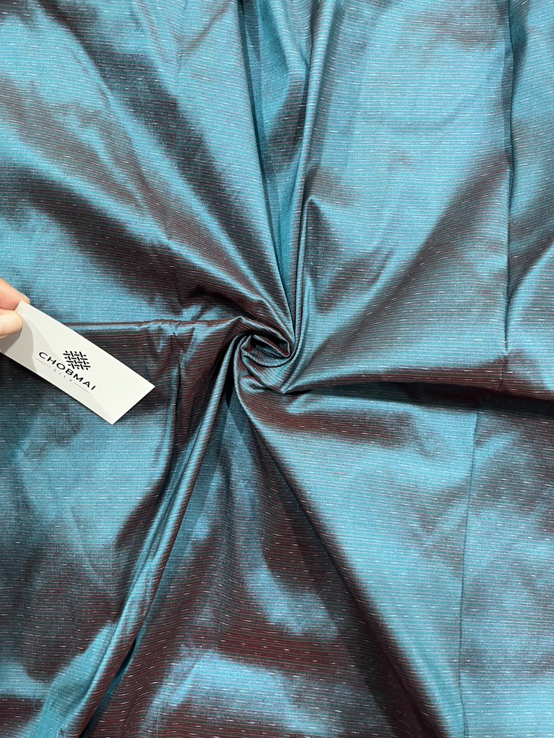 ผ้าไหมมัดหมี่ ไหมแท้ ลายอัมปรม สีเขียวเทอร์ควอยซ์ ตัดขายเป็นเมตร รหัส CISP-NY-1024683