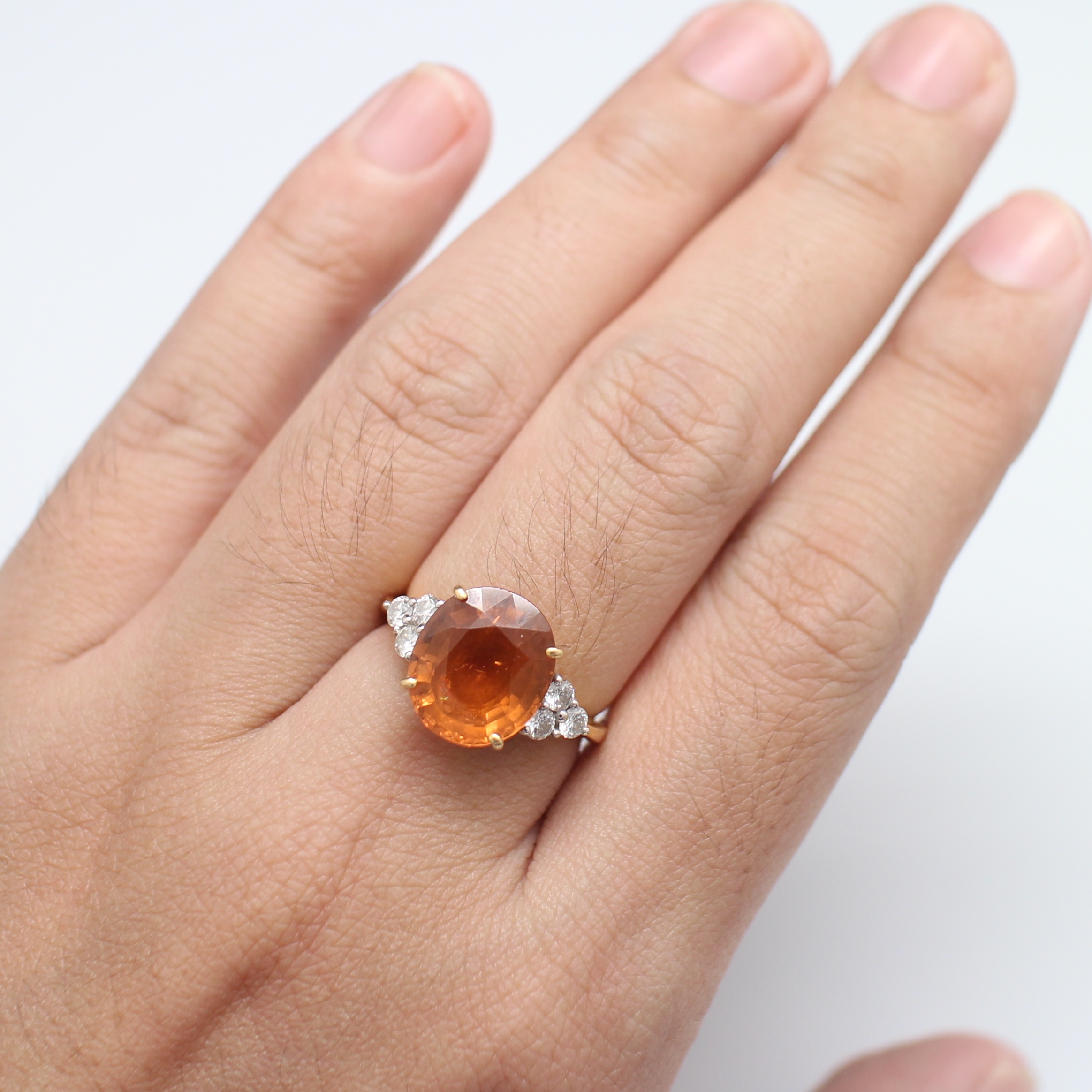 RG250086 แหวนโกเมนสีส้ม บ่าขางเพชรแท้ 6 เม็ด 0.36 กะรัต ทองแท้ 90% นน.รวม 5.2 กรัม ขนาดแหวน 55