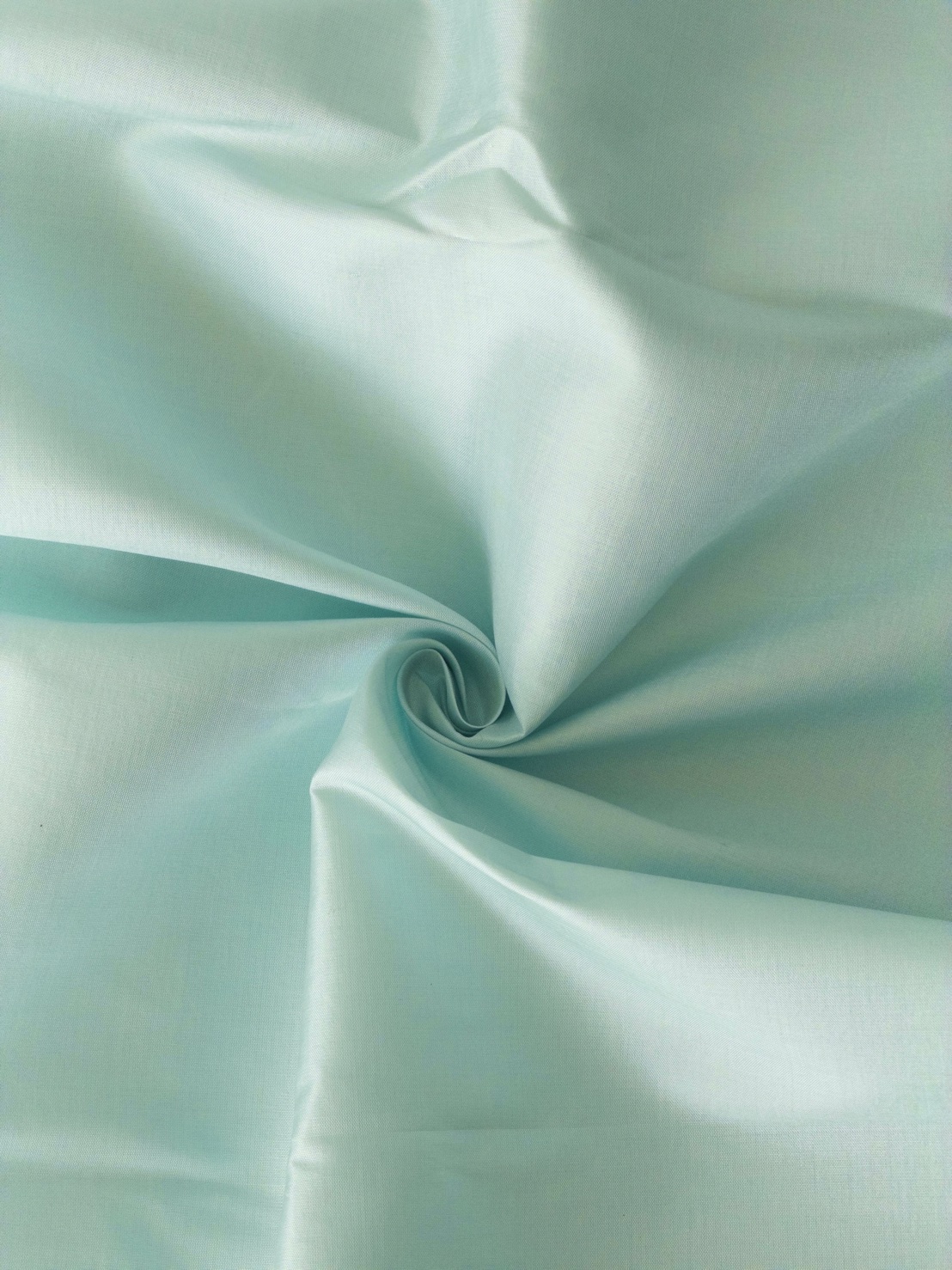 ผ้าไหมสีพื้น เนื้อเรียบ ตรานกยูงพระราชทาน สีเขียวมิ้นต์อมฟ้าอ่อน (ราคาต่อหลา) รหัส C-119-2025PC1