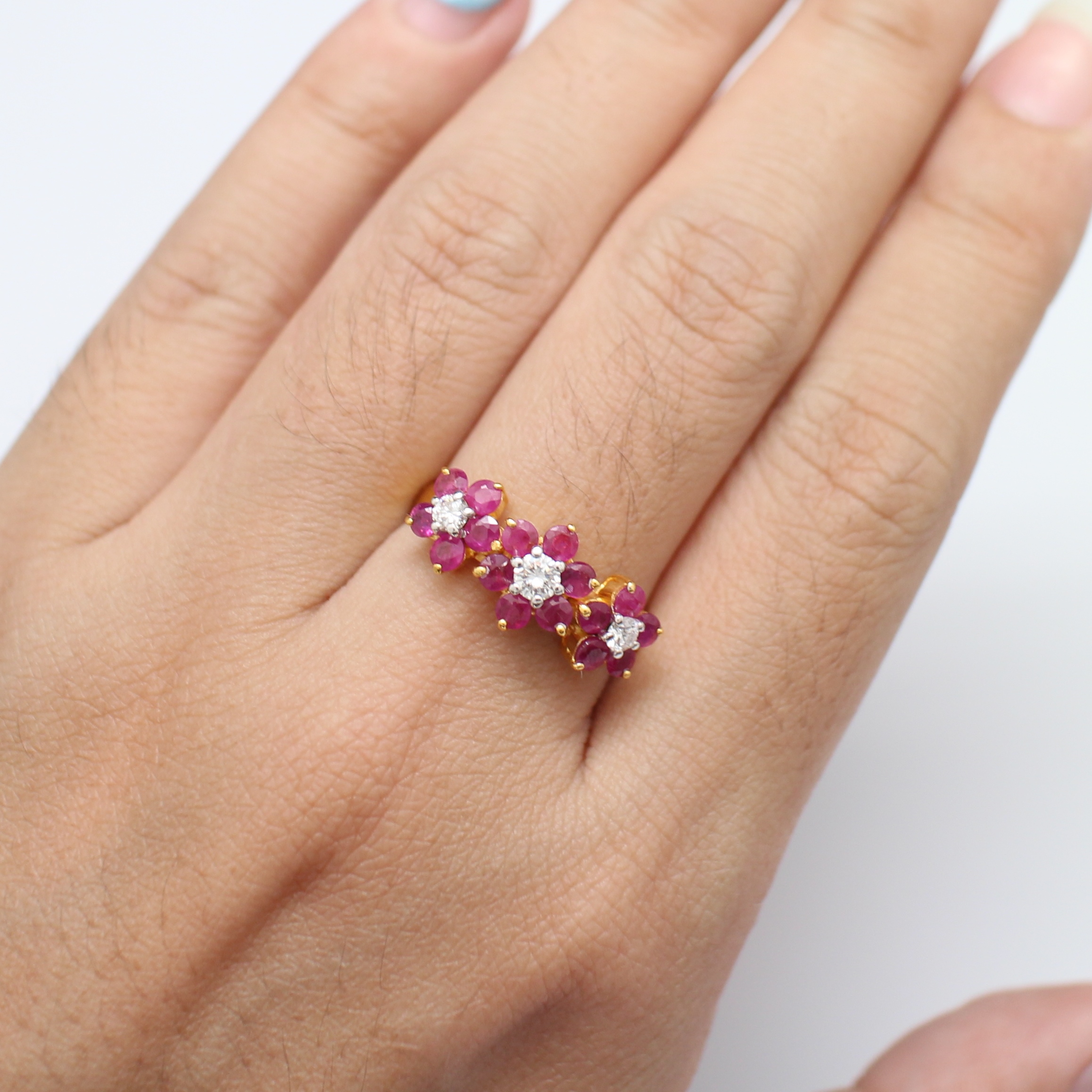 RG250106 แหวนทับทิมดอกไม้ฝังเพชรเพชรแท้ 1 เม็ด 0.15 กะรัต และ 2 เม็ด 0.16 กะรัต ทองแท้ 90% นน.รวม 4.2 กรัม ขนาดแหวน 59