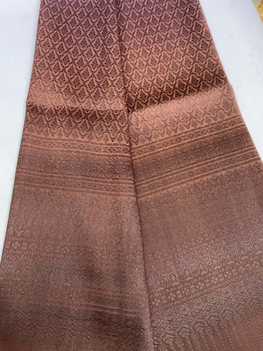 ซิ่น ผ้าไหมยกดอกสุรินทร์ 32ตะกอ ขนาด 1x2เมตร ลายเทพพนม ย้อมสไลด์สีม่วงเทาเข้ม - สีน้ำตาล รหัส N11-TT-0803684
