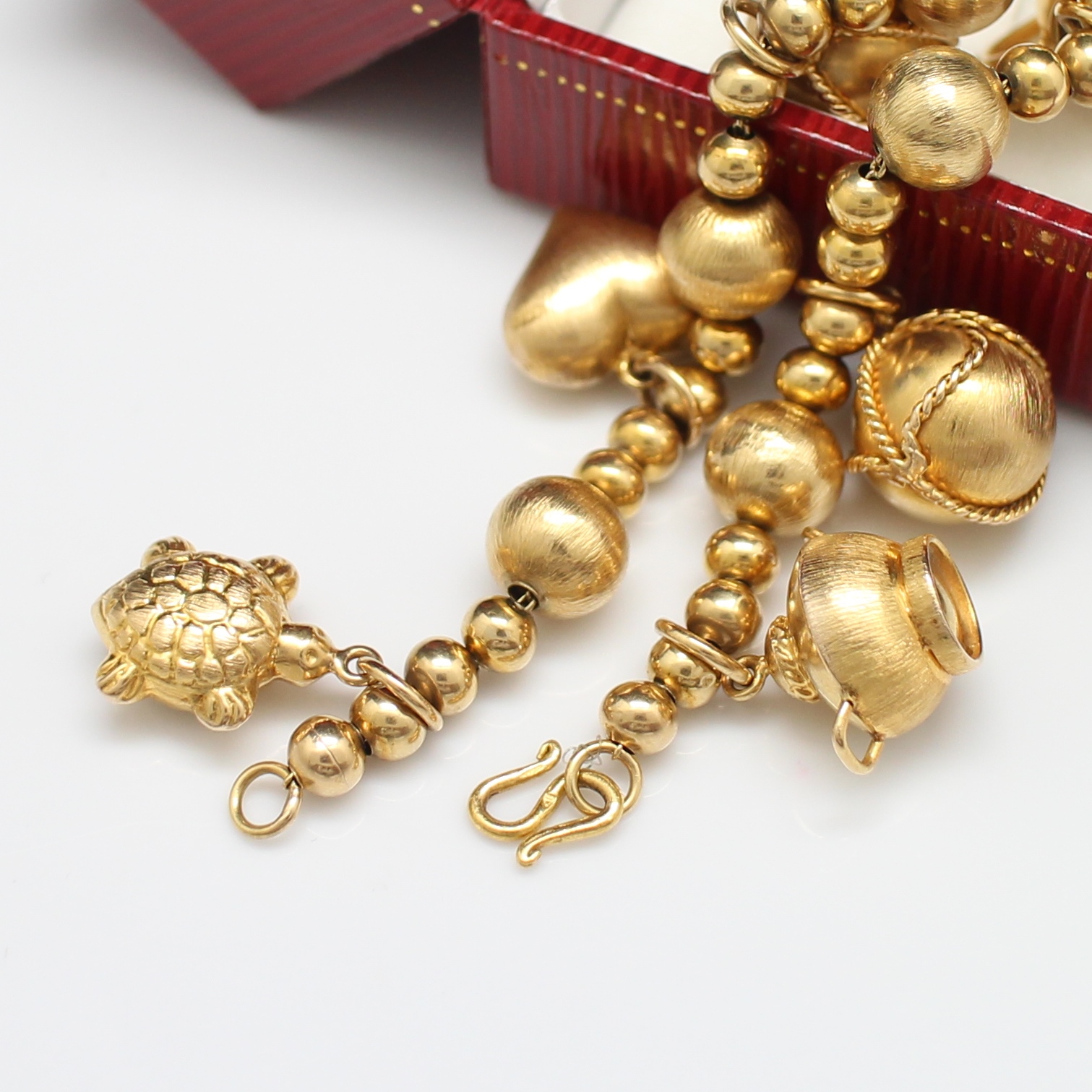 BL25042 สร้อยข้อมือตุ้งติ้ง เต่า หัวใจ หม้อ ทองแท้ 90% นน.รวม 32 กรัม ยาว 17.5 ซม. งานสวย สภาพดี