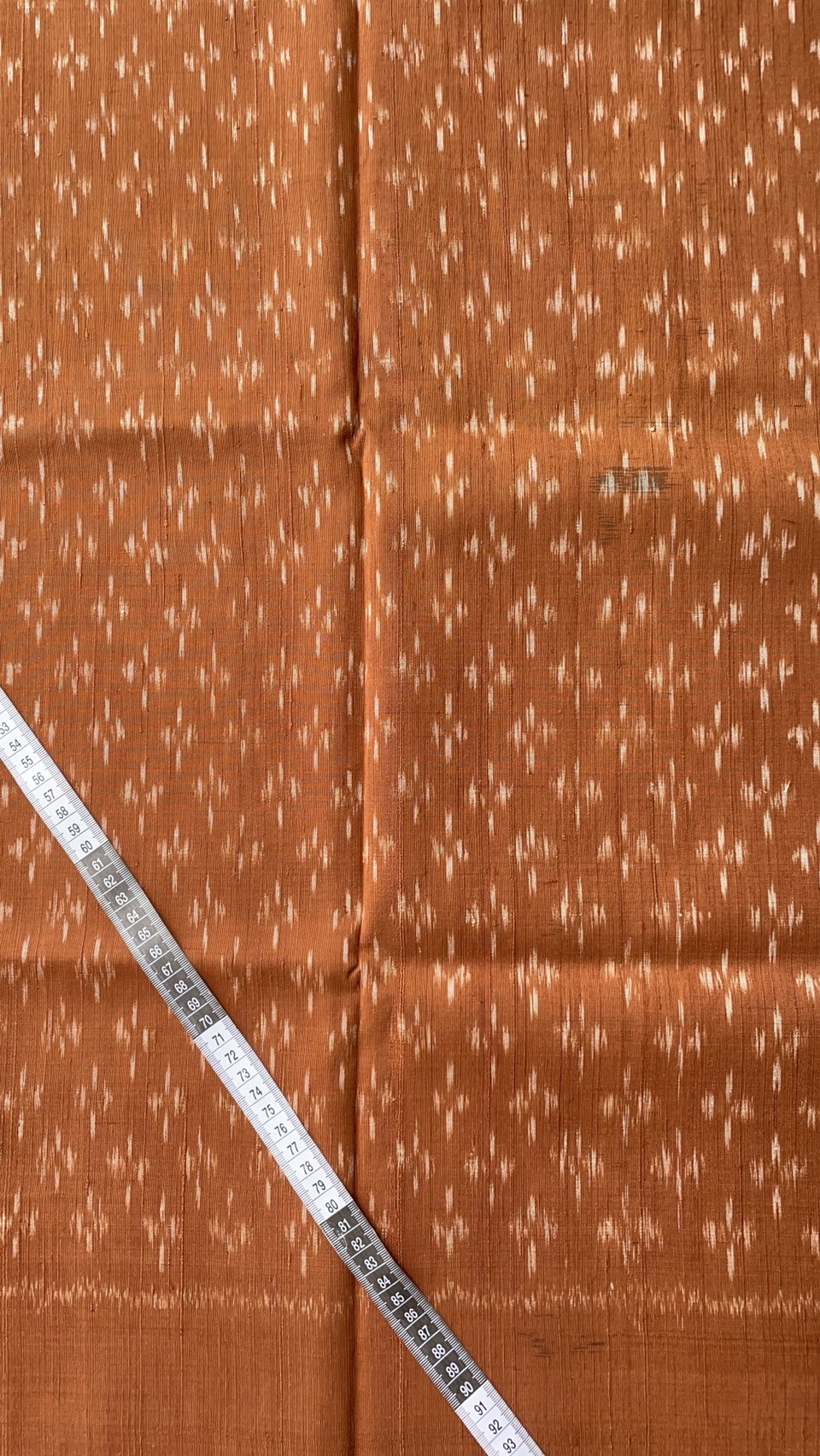 ผ้าไหมมัดหมี่ เนื้อไหมบ้าน ไหมแท้ สีธรรมชาติ ลายดอกแก้วน้อย สีส้มน้ำตาลอิฐ ตัดขายเป็นเมตร รหัส CISP-NY-SKU-39320