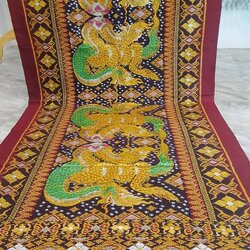 ซิ่น ผ้าไหมมัดหมี่ ทอยกดอก งานเขียนทอง ขนาด 1x2เมตร ลายพญานาค มีหน้านางชายครุย ท้องผ้าสีดำเชิงแดง รหัส M2A-43-0531681