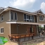6-004 บ้านน็อคดาวน์ยกสูง 2 ชั้น ทรงปั้นหยาผสมมะนิลา สีน้ำตาล